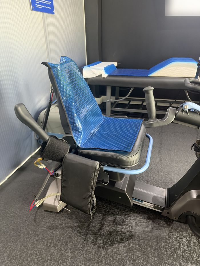 Cooled seat with leg and arm cuffs